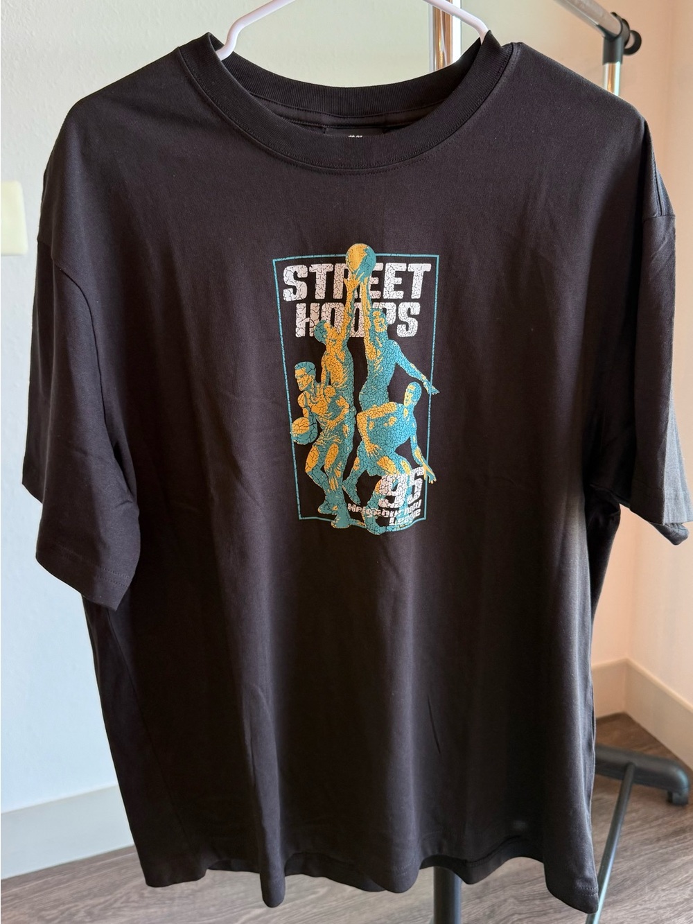 H&M Black Short Sleeve Tee with Blue and Gold Graphic